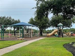 community play area featuring a lawn