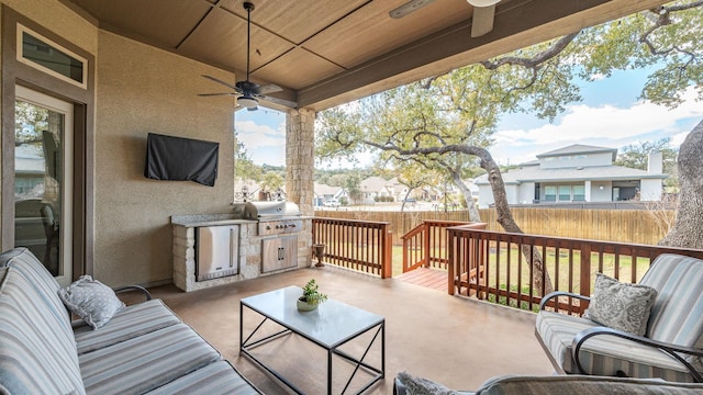 view of patio featuring a ceiling fan, fence, a residential view, a grill, and an outdoor hangout area