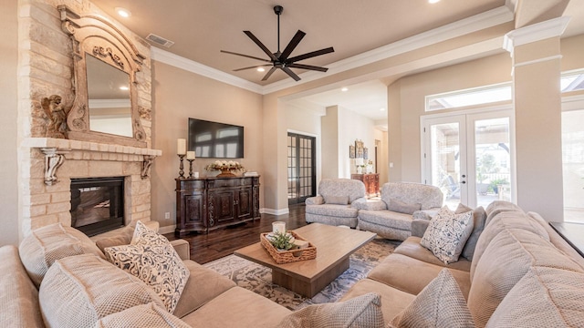 living area with french doors, visible vents, ceiling fan, and crown molding