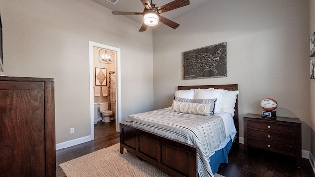 bedroom with ensuite bath, a ceiling fan, baseboards, and wood finished floors