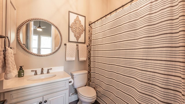 full bath featuring vanity, toilet, and ceiling fan