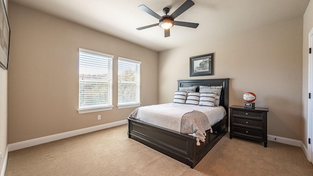 bedroom featuring baseboards, carpet, and a ceiling fan