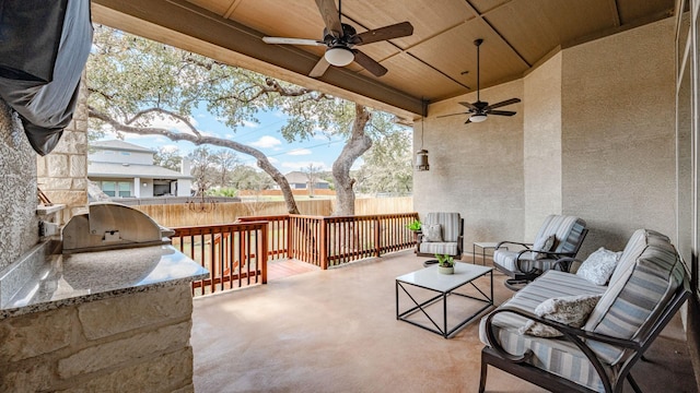 view of patio / terrace with outdoor lounge area, area for grilling, a ceiling fan, and fence