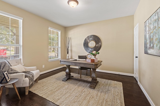 home office with baseboards and dark wood-style flooring