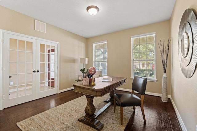 home office with visible vents, hardwood / wood-style floors, and french doors