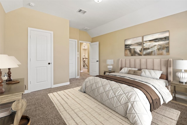 bedroom featuring vaulted ceiling, baseboards, visible vents, and light carpet