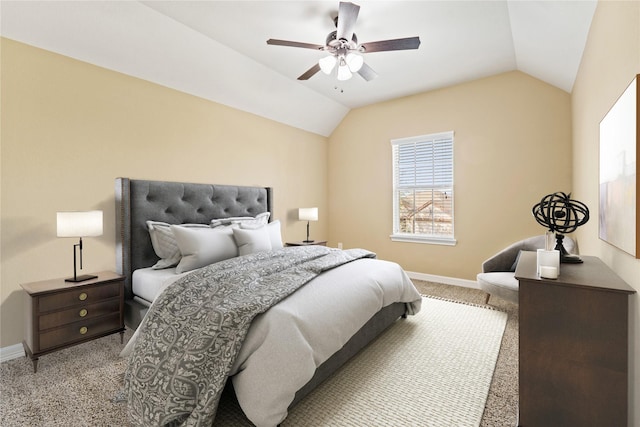 carpeted bedroom featuring vaulted ceiling, a ceiling fan, and baseboards