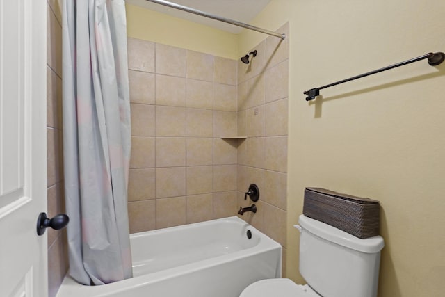 bathroom with shower / bath combination with curtain and toilet