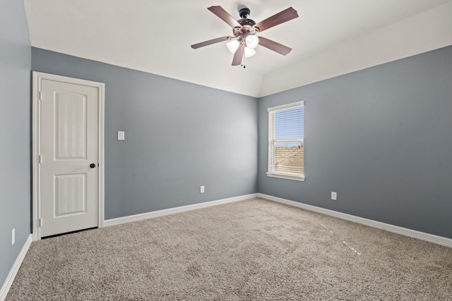 empty room with baseboards, a ceiling fan, and carpet