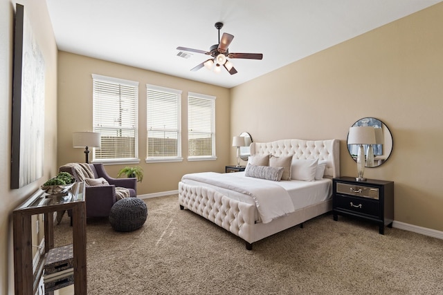 bedroom with visible vents, baseboards, carpet floors, and ceiling fan