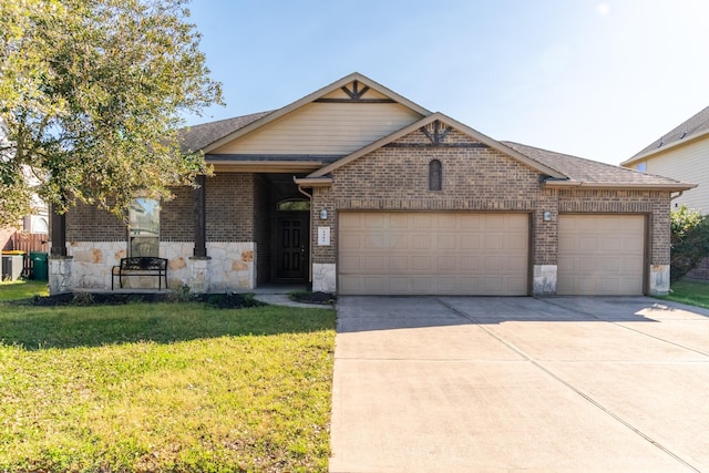 view of front of home with an attached garage, a front lawn, concrete driveway, stone siding, and brick siding