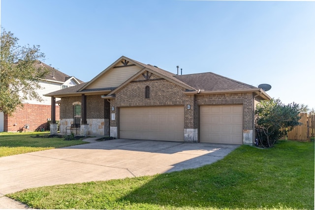 view of front of property featuring driveway, roof with shingles, a front yard, a garage, and brick siding