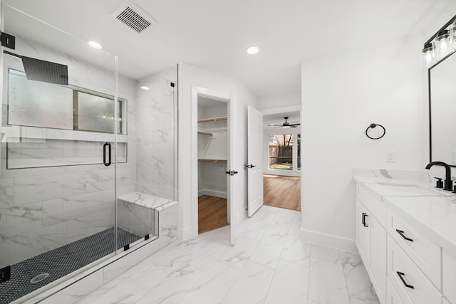 full bath with visible vents, marble finish floor, recessed lighting, a marble finish shower, and baseboards