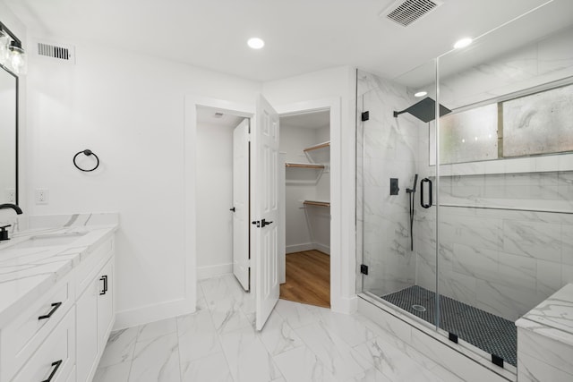 full bathroom featuring a marble finish shower, visible vents, baseboards, and marble finish floor