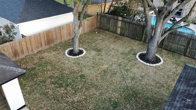 view of yard with a fenced backyard