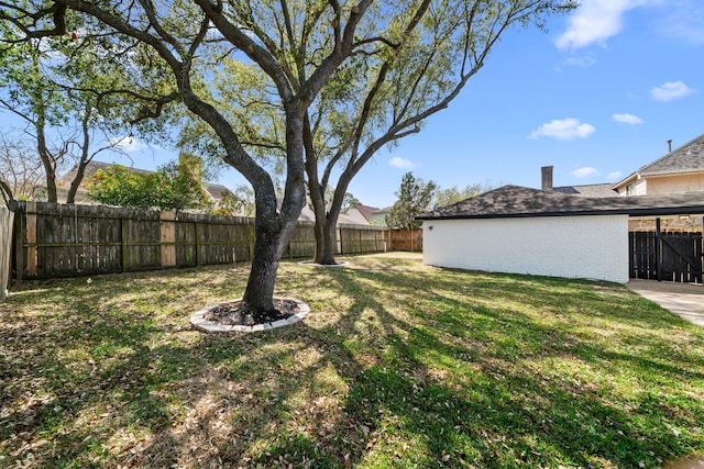 view of yard with a fenced backyard