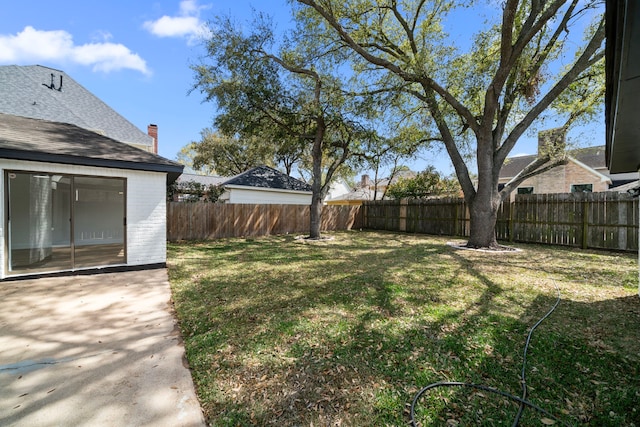 view of yard featuring a fenced backyard