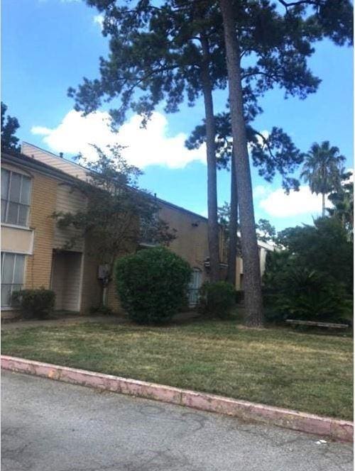 view of property exterior featuring a yard