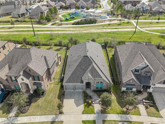 birds eye view of property with a residential view