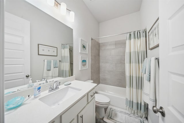 bathroom featuring vanity, toilet, and shower / bath combo with shower curtain