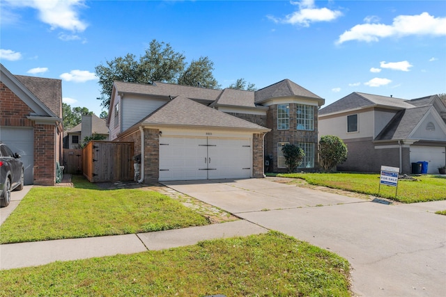 view of front facade with a garage, brick siding, concrete driveway, and a front lawn