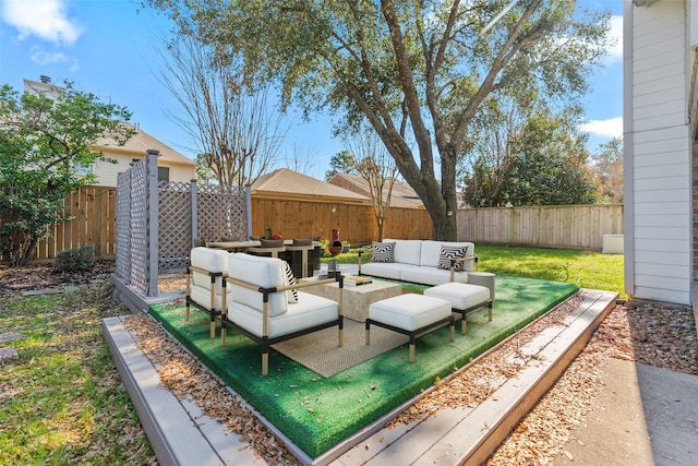 view of patio / terrace featuring an outdoor hangout area and a fenced backyard