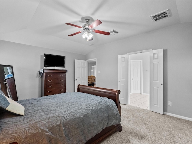 carpeted bedroom with visible vents, ceiling fan, baseboards, and vaulted ceiling