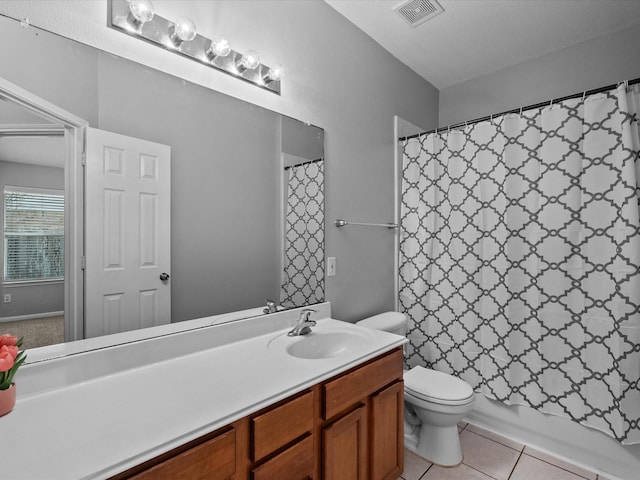 bathroom featuring tile patterned floors, visible vents, toilet, and vanity