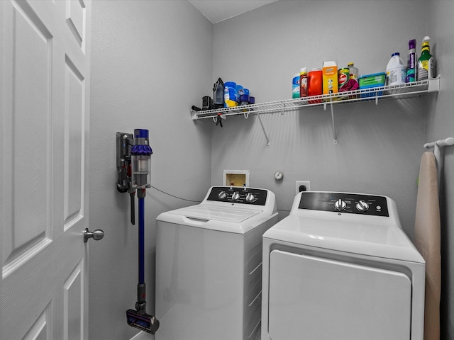 washroom with washer and clothes dryer and laundry area