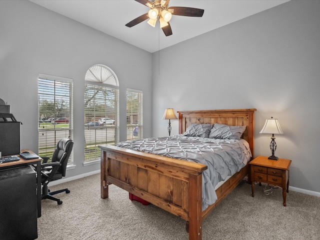 bedroom with baseboards, carpet floors, and ceiling fan