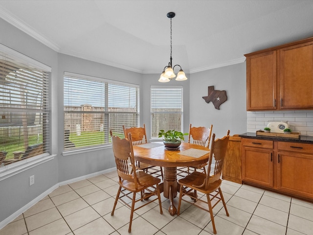 dining room featuring an inviting chandelier, light tile patterned flooring, and crown molding