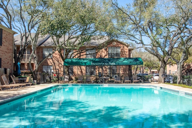 community pool with fence