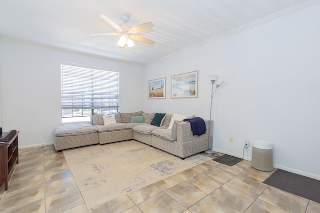 tiled living room featuring baseboards, ornamental molding, and a ceiling fan