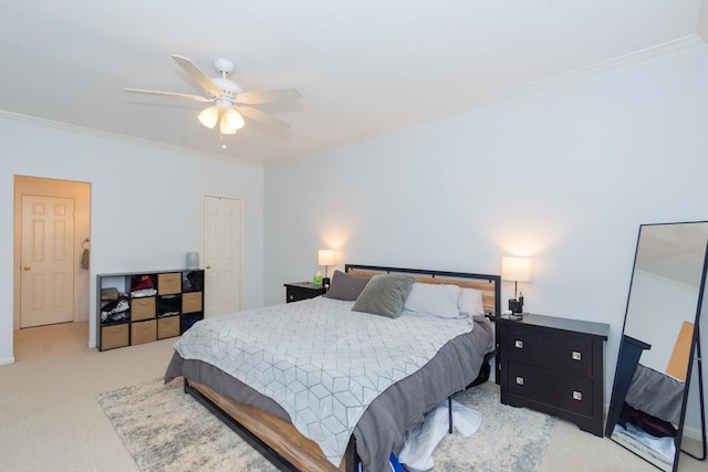 bedroom with ceiling fan, light colored carpet, and ornamental molding