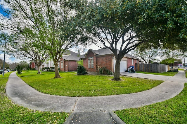 view of side of property with brick siding, fence, concrete driveway, a lawn, and an attached garage