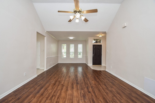 unfurnished living room with ceiling fan, baseboards, high vaulted ceiling, and wood finished floors