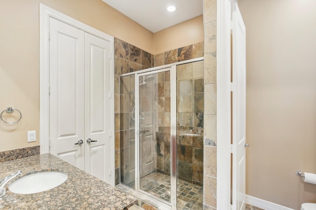 full bath featuring a stall shower and vanity