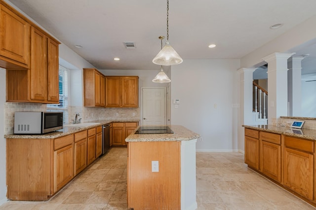 kitchen featuring decorative backsplash, light stone counters, visible vents, and appliances with stainless steel finishes