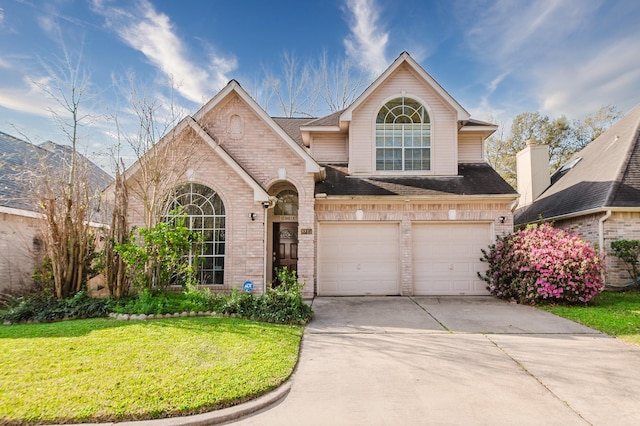 view of front of home featuring brick siding, a shingled roof, a front lawn, concrete driveway, and a garage