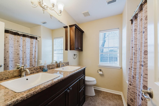 full bathroom featuring visible vents and a sink