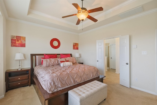 bedroom with visible vents, a raised ceiling, light colored carpet, and ornamental molding