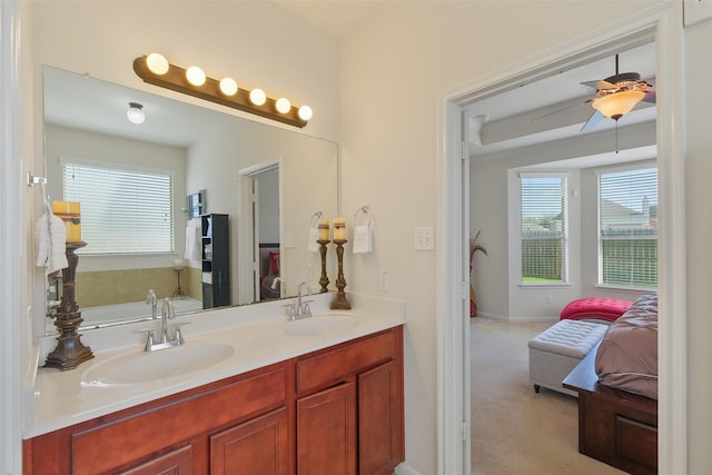 ensuite bathroom featuring double vanity, ensuite bathroom, and a sink