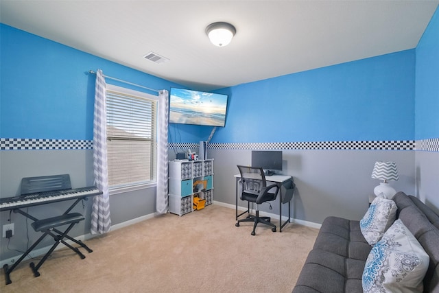 carpeted home office featuring visible vents and baseboards