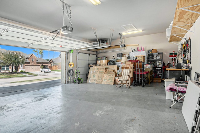 garage featuring a workshop area and a garage door opener