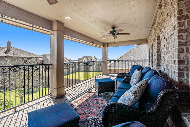 view of patio with an outdoor living space, a balcony, and ceiling fan