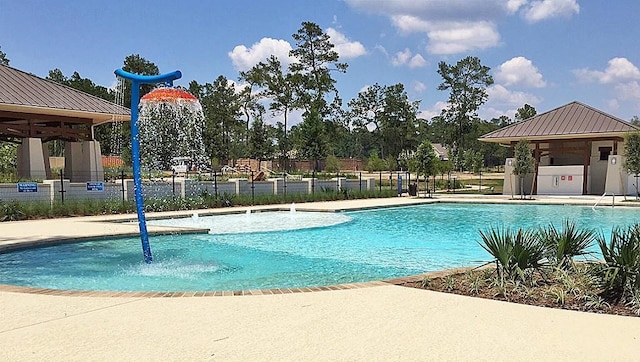 pool featuring a patio area and fence