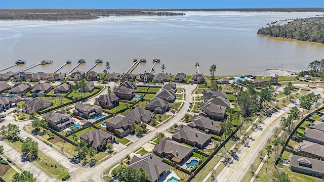 bird's eye view featuring a residential view and a water view