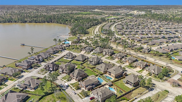 birds eye view of property with a residential view and a water view