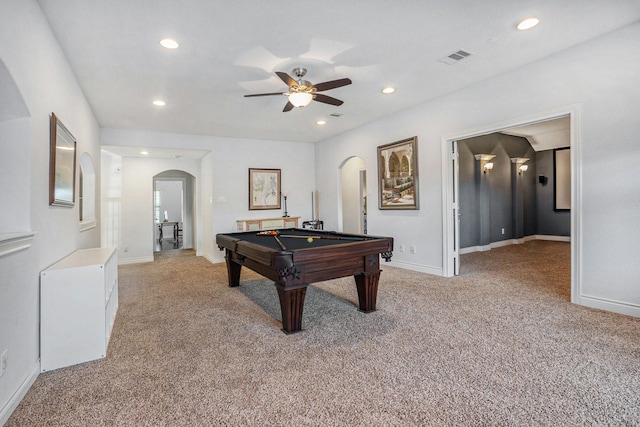 recreation room with a ceiling fan, pool table, light colored carpet, and arched walkways