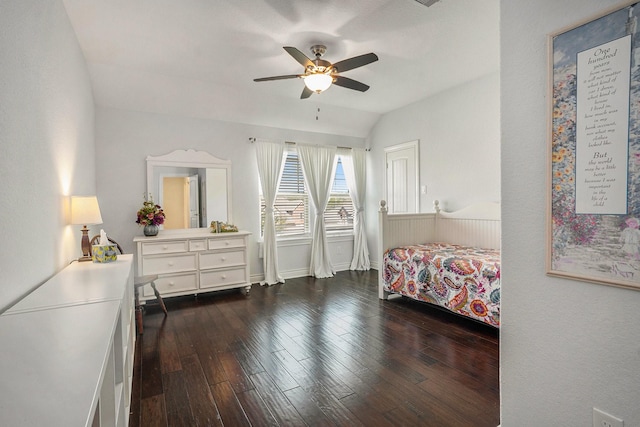 bedroom featuring dark wood-style floors, baseboards, a ceiling fan, and vaulted ceiling